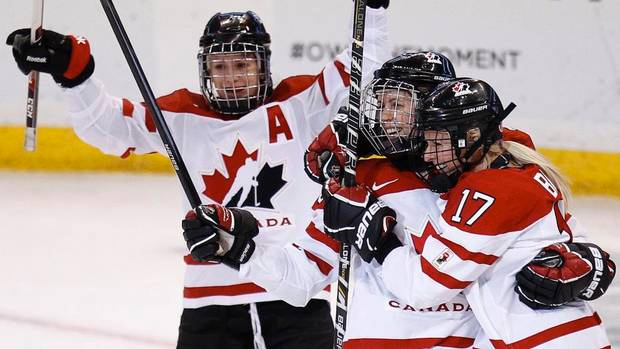 Canada's Bailey Bram (R) celebrates her goal against Finland with teammates Gillian Apps (C) and Catherine Ward during the first period of their preliminary round game at the IIHF Ice Hockey Women's World Championship in Ottawa April 5, 2013. Canada won 3-2. (CHRIS WATTIE/REUTERS)